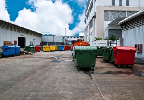 Recycling bins and sorted materials ready for transfer at a clearance site